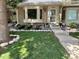 Beautiful townhome with well-maintained lawn, rock garden, and inviting front entrance at 7624 S Cove Cir, Centennial, CO 80122