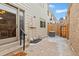 Back patio including welcome mat and air conditioning unit at 7624 S Cove Cir, Centennial, CO 80122