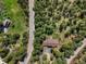 Overhead view of a home with a deck and hot tub surrounded by lush forest at 8422 S Ault Ln, Morrison, CO 80465