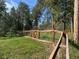 Fenced backyard with mature trees at 8422 S Ault Ln, Morrison, CO 80465