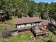 Backyard aerial view features a multi-level deck with seating and hot tub at 8422 S Ault Ln, Morrison, CO 80465