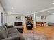 Open basement featuring a fireplace, pool table, comfortable seating and a staircase at 8422 S Ault Ln, Morrison, CO 80465