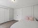 Cozy bedroom featuring neutral walls, plush carpeting and a closet with ample storage space at 8422 S Ault Ln, Morrison, CO 80465