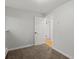 Small bedroom with open doorway and neutral walls at 8422 S Ault Ln, Morrison, CO 80465