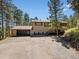 Inviting exterior view shows a well-maintained home with a spacious driveway and garage at 8422 S Ault Ln, Morrison, CO 80465