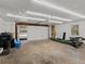 Spacious garage with an insulated door, a garage door opener and room for storage at 8422 S Ault Ln, Morrison, CO 80465