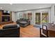 Cozy living room features a fireplace, comfortable seating, and access to a deck at 8422 S Ault Ln, Morrison, CO 80465