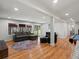 Spacious living room with wood floors, neutral paint and access to the outdoors at 8422 S Ault Ln, Morrison, CO 80465