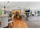 Open-concept living space combines kitchen, dining, and living areas with hardwood floors at 8422 S Ault Ln, Morrison, CO 80465