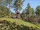 Beautiful home nestled among mature trees, featuring a charming treehouse at 8422 S Ault Ln, Morrison, CO 80465