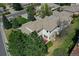 Impressive home with a backyard deck surrounded by mature trees and lush greenery at 13950 E Chenango Dr, Aurora, CO 80015