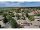 Aerial view showcasing the neighborhood's lush green landscape and beautiful homes in the community at 13950 E Chenango Dr, Aurora, CO 80015