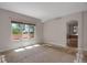 Bright bedroom with natural light and an ensuite bathroom access at 13950 E Chenango Dr, Aurora, CO 80015
