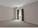 Serene bedroom features neutral carpet and curtains, creating a cozy and inviting space at 13950 E Chenango Dr, Aurora, CO 80015