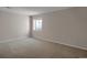 Cozy bedroom boasts neutral carpet and white walls, perfect for restful nights and relaxation at 13950 E Chenango Dr, Aurora, CO 80015