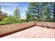 Exterior deck with greenery backdrop and stucco surround at 13950 E Chenango Dr, Aurora, CO 80015