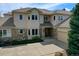 Beautiful home with a tile roof, stone accents, manicured landscaping and a large driveway at 13950 E Chenango Dr, Aurora, CO 80015