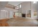 Open concept living room space with high ceilings and fireplace at 13950 E Chenango Dr, Aurora, CO 80015