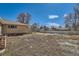 Backyard featuring a partial view of a brick home and fencing, presenting a canvas for landscaping and outdoor living at 2525 S Ivanhoe Pl, Denver, CO 80222