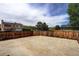 The expansive backyard is enclosed by a wooden fence and has a large concrete patio area at 11883 W Marlowe Pl, Morrison, CO 80465