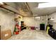 Unfinished basement with concrete walls and floors is used for storage, featuring boxes and suitcases at 11883 W Marlowe Pl, Morrison, CO 80465