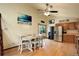 Open dining area with seating for six, with adjacent kitchen area at 11883 W Marlowe Pl, Morrison, CO 80465