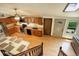 Open-concept kitchen with modern appliances and butcher block countertops and skylight at 11883 W Marlowe Pl, Morrison, CO 80465