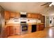 Functional kitchen with stainless steel appliances and ample counter space at 11883 W Marlowe Pl, Morrison, CO 80465