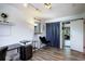 Office area boasts hardwood floors, natural light, track lighting, and a sliding door at 11883 W Marlowe Pl, Morrison, CO 80465