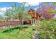 Backyard showing grassy yard, fencing, and access to the home's outdoor spaces at 3513 Quitman St, Denver, CO 80212