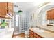 Bright bathroom featuring wood cabinets, vanity with sink and glass block shower at 3513 Quitman St, Denver, CO 80212