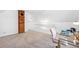 Bedroom with brick column, white railing, pink desk chair, and neutral carpet at 3513 Quitman St, Denver, CO 80212