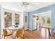 Inviting dining area with hardwood floors, a cozy breakfast nook, and access to the kitchen and backyard at 3513 Quitman St, Denver, CO 80212