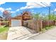 Exterior view with a garage, long driveway, and privacy fencing at 3513 Quitman St, Denver, CO 80212