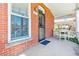 Charming front porch featuring red brick, secure entry, and an outdoor seating area at 3513 Quitman St, Denver, CO 80212
