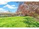 Lush front yard with a mature tree, offering a serene setting at 3513 Quitman St, Denver, CO 80212