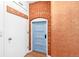 Hallway features a brick archway and accent wall plus white and wood doors at 3513 Quitman St, Denver, CO 80212