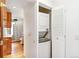 A laundry closet with a stacked washer and dryer located near the bathroom at 3513 Quitman St, Denver, CO 80212