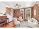 Inviting living room featuring exposed brick walls, hardwood floors, and stylish furniture with ample natural light at 3513 Quitman St, Denver, CO 80212