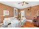 Bright living room featuring exposed brick walls, hardwood floors, and elegant decor at 3513 Quitman St, Denver, CO 80212
