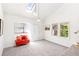 Bright living room with a skylight, white walls, carpet flooring and large windows at 3513 Quitman St, Denver, CO 80212