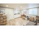 Spacious finished basement with wood floors, storage cabinets, and ample space for activities at 1261 W 170Th Ave, Broomfield, CO 80023