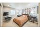Inviting bedroom featuring a patterned accent wall, contemporary furnishings, and ample natural light at 1261 W 170Th Ave, Broomfield, CO 80023