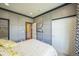 Stylish bedroom featuring decorative wall paneling, neutral tones, and elegant window treatments at 1261 W 170Th Ave, Broomfield, CO 80023