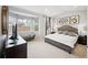 Bright main bedroom featuring a bay window, a comfortable bed, and elegant decor at 1261 W 170Th Ave, Broomfield, CO 80023