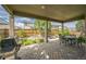 Covered patio featuring a built in grill and outdoor seating in a well-maintained backyard at 1261 W 170Th Ave, Broomfield, CO 80023