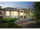 Back exterior view of a single Gathering home with a covered patio and manicured lawn at 1261 W 170Th Ave, Broomfield, CO 80023