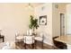 Bright dining area with a glass-top table, stylish chairs, and modern lighting for intimate meals at 5562 W 72Nd Pl, Westminster, CO 80003