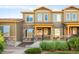 Charming townhome with stone accents, landscaped front yard, and cozy porch at 5562 W 72Nd Pl, Westminster, CO 80003