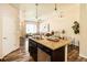 Open kitchen with granite countertops, stainless steel appliances, and seamless flow into the living area at 5562 W 72Nd Pl, Westminster, CO 80003